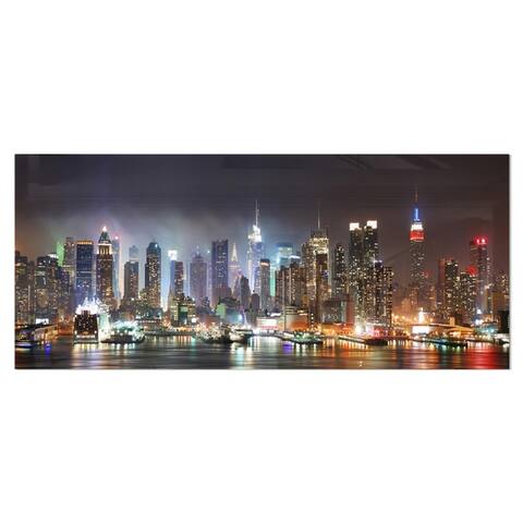 Designart 'Lit NYC Manhattan Skyline' Cityscape Photo Metal Wall Art