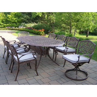 Dakota Cast Aluminum 9 Pc Dining Set with Oval Table, 6 Cushioned Chairs and 2 Swivel Rockers