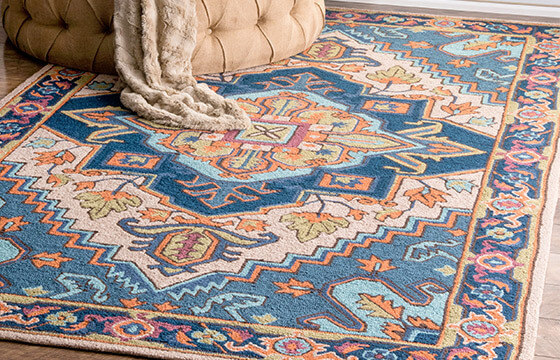 Traditional orange and navy blue area rug. 