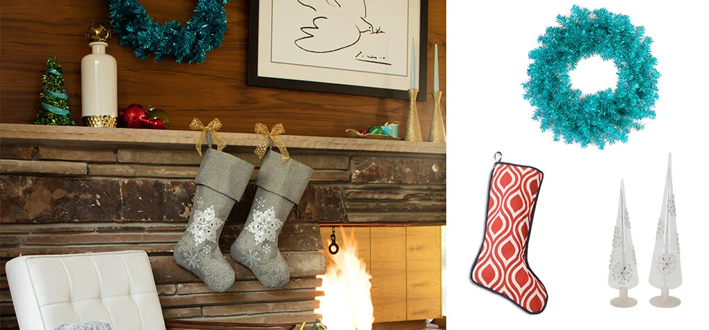 Close up of fireplace with mid-century modern Christmas decor, featuring three products  red and white retro patterned stocking, blue wreath, and silver mini trees