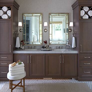 Double vanity with two mirrors and bathroom accessories with storage cabinets on each side 