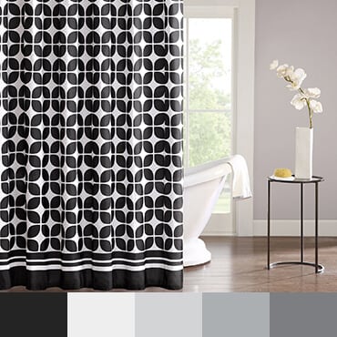 Black and white shower curtain shown in bathroom with a black and white color palette