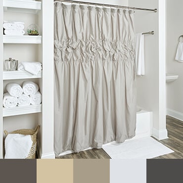 Grey shower curtain shown in bathroom with  netural tone color palette