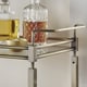 Metropolitan Antique Brass Metal Mobile Bar Cart with Glass Top by INSPIRE Q