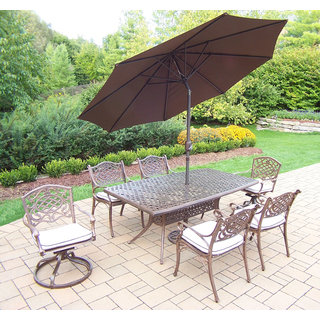 Merit 9 Pc Dining Set with Boat Table, 2 Cushioned Swivel Rockers, 4 Cushioned Chairs and Brown Umbrella with Metal Stand