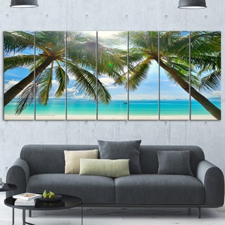 Designart 'Palm Hanging over Sandy White Beach' Seashore Glossy Metal Wall Art