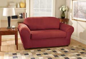Burgundy stretch suede slipcover elegantly protects sofa