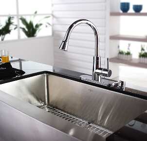 Chrome kitchen faucet over a steel sink