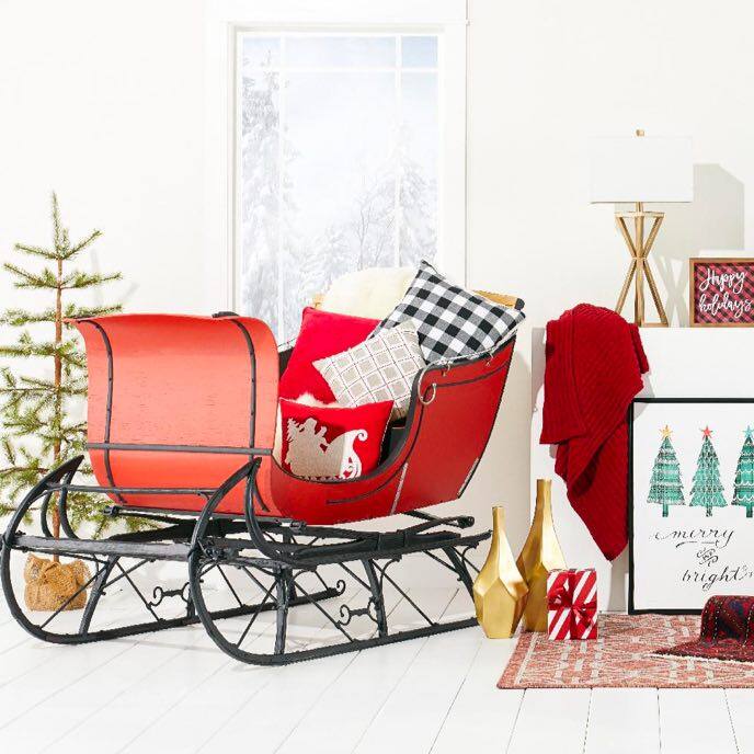 a santa sleigh filled with throw pillows available at Great Offer Stock.com