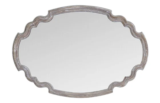 A distressed oval mirror 