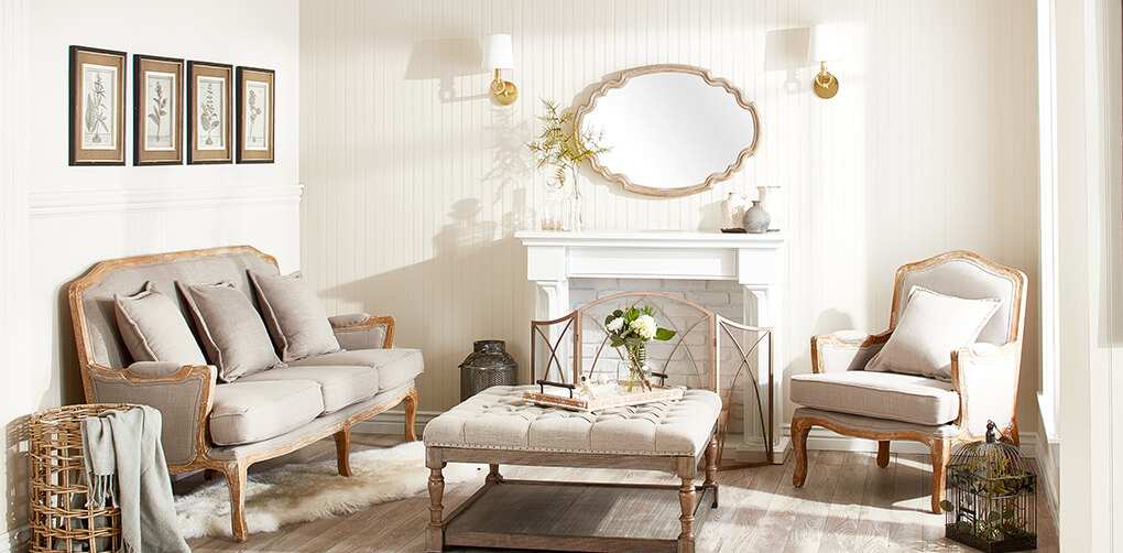 A beautiful french country living room with linen furniture and shabby chic decor