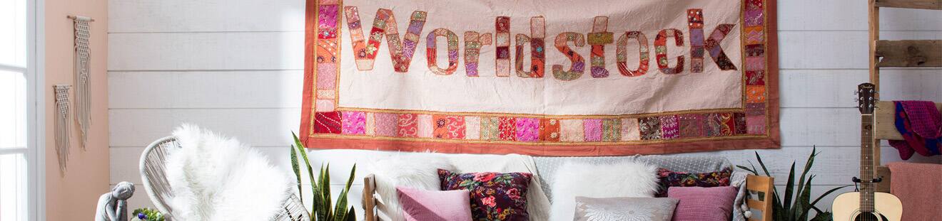 Worldstock quilt hanging in eclectic living room