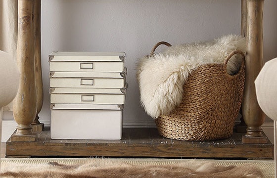 White decorative boxes and wicker basket