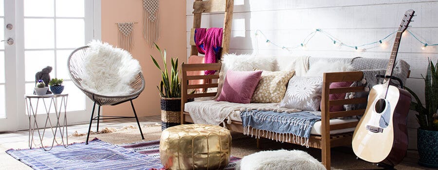 Boho Chic-styled living room with floor pillows, string lights, and a guitar