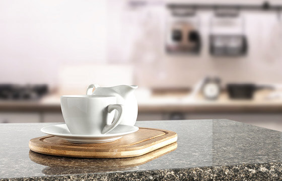 Granite countertop with white coffee mug on top