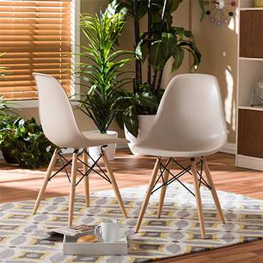 Two white  mid-century chairs on rug