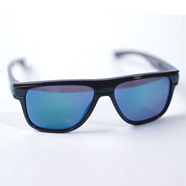 A pair of Oakley sunglasses faceing forward