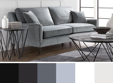 A cool modern living room with a modern color palette below; containing colors of black, grey, white, and blues
