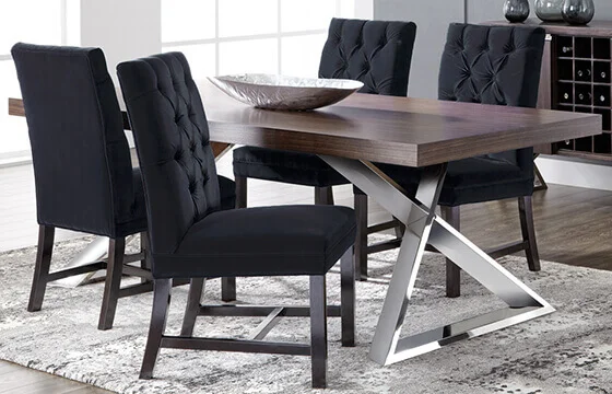A modern sleek wooden dining table with a metal base 