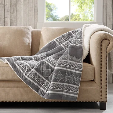 Woolrich down alternative throw with grey  and white print