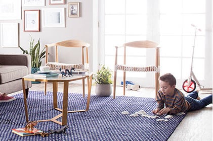 Living room with boy playing on floor